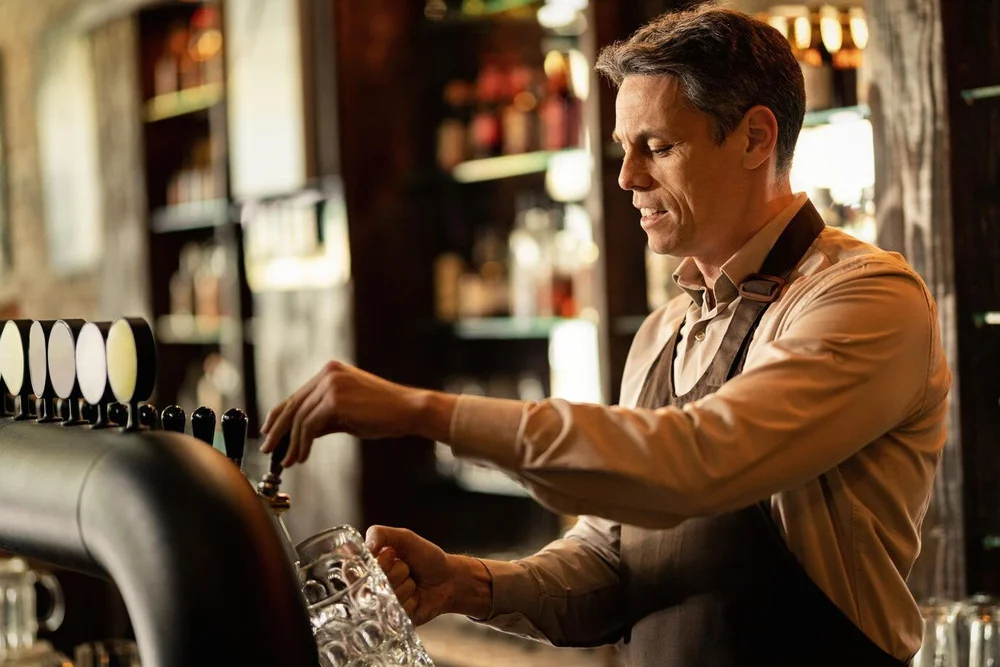 Bartender pouring a beer